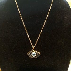 Gold and eye necklace